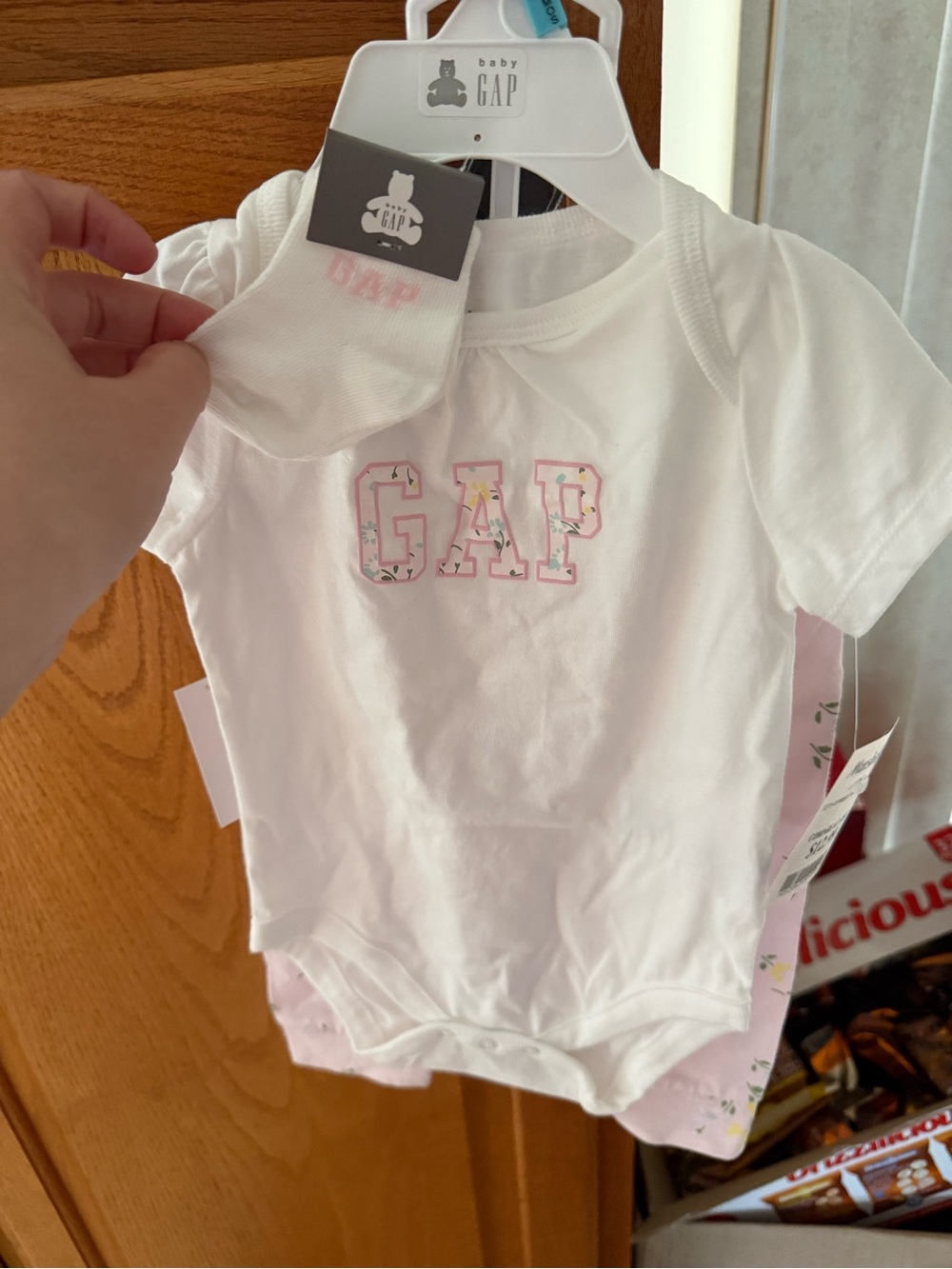 GAP White Baby Onesie with Pink Floral Logo